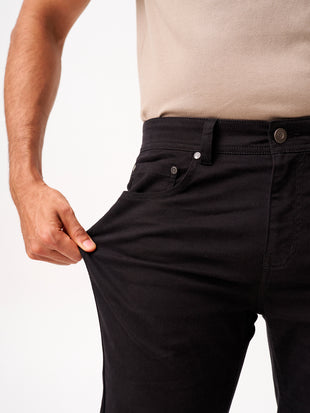close-up view of infinite black jeanos by pant project highlighting stretch fabric