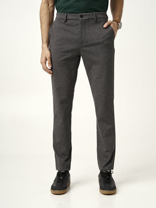 close view of waistband and button on charcoal pants from the Pant Project