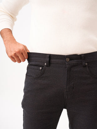 close-up front view of wood brown check jeanos by pant project showcasing stretch