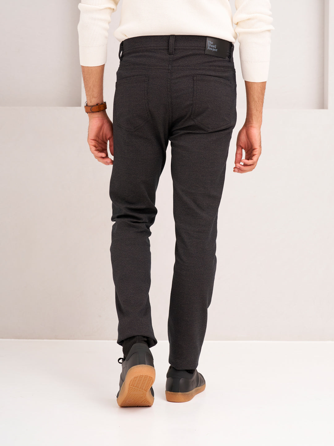 back view of wood brown check jeanos by pant project showcasing tailored fit