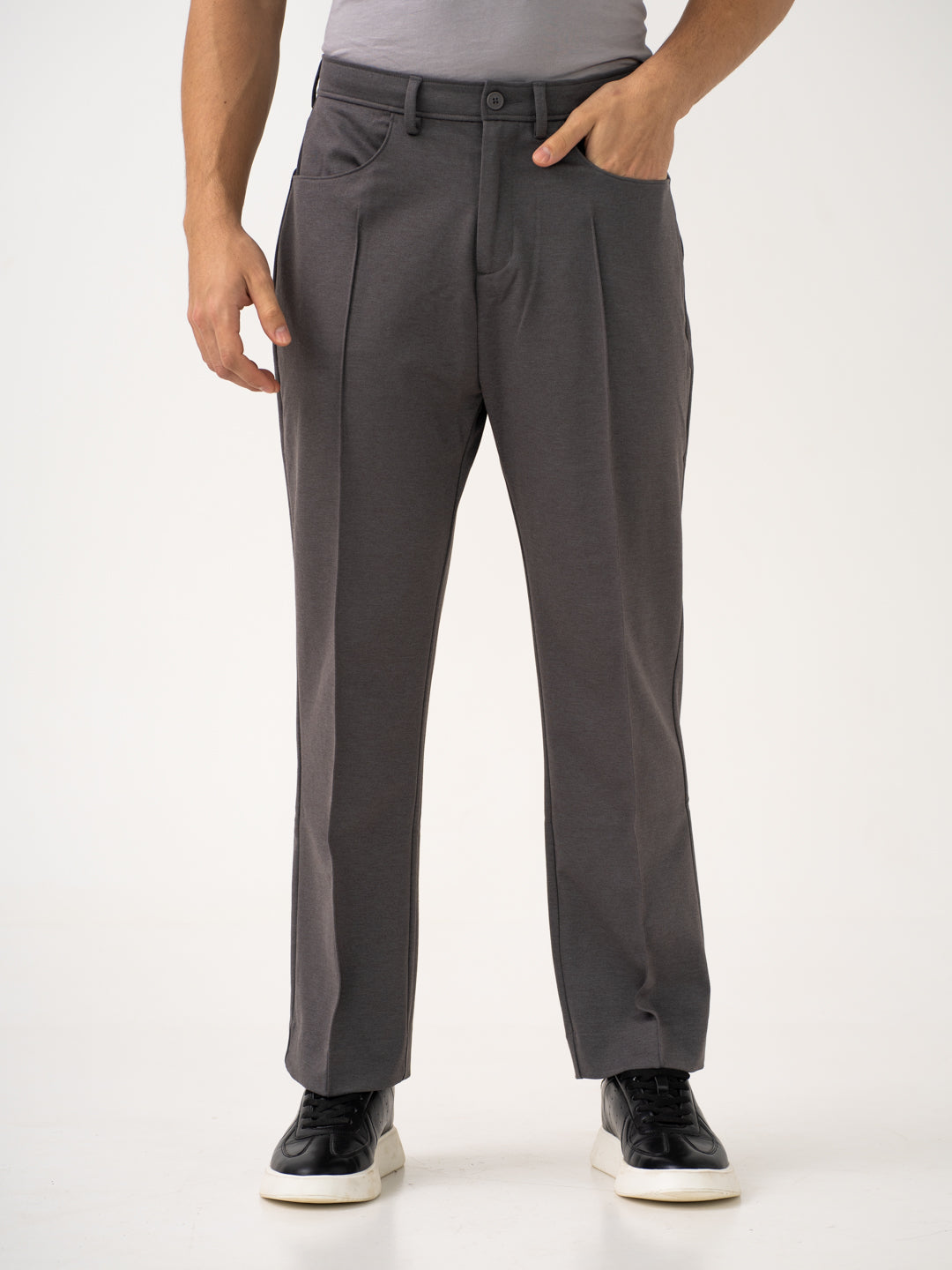 Full view of grey pintuck pants by Pant Project, focusing on the relaxed fit and waistband details