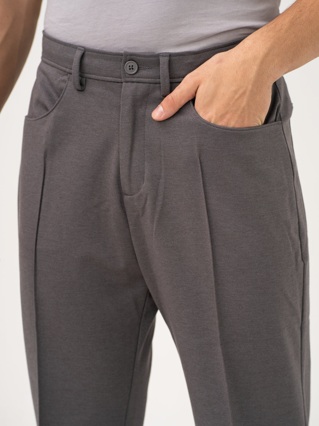 Close-up view of grey pants by Pant Project, focusing on the waistband and pocket details