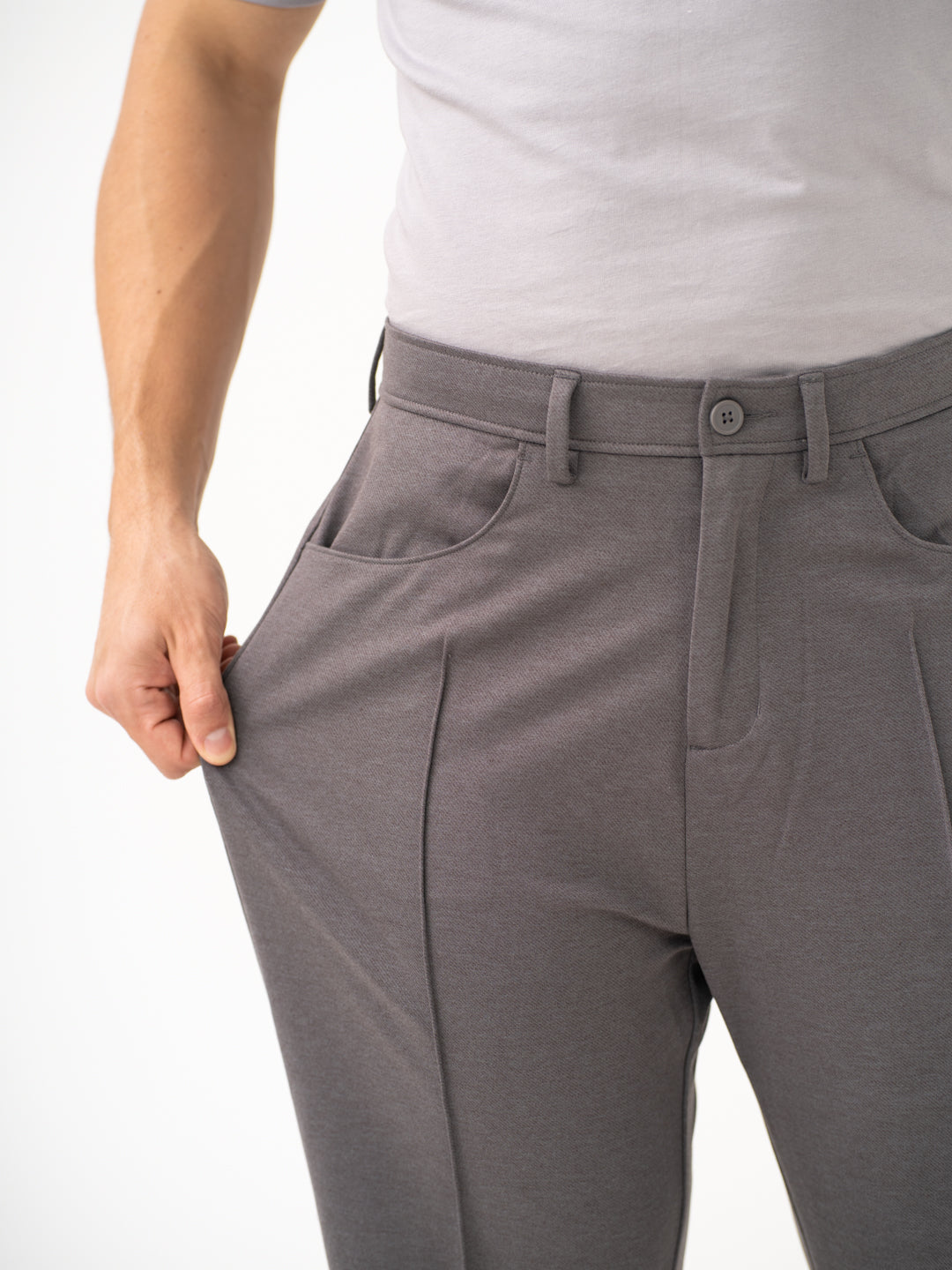 Close-up view of grey pants by Pant Project, focusing on the stretchable waistband