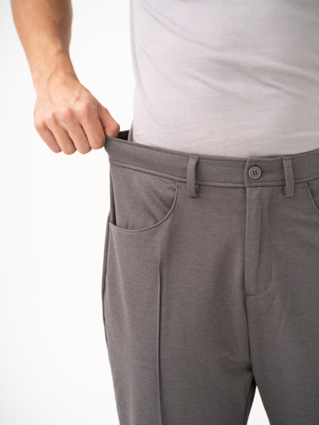 Close-up view of grey pants by Pant Project, focusing on the stretchable waistband