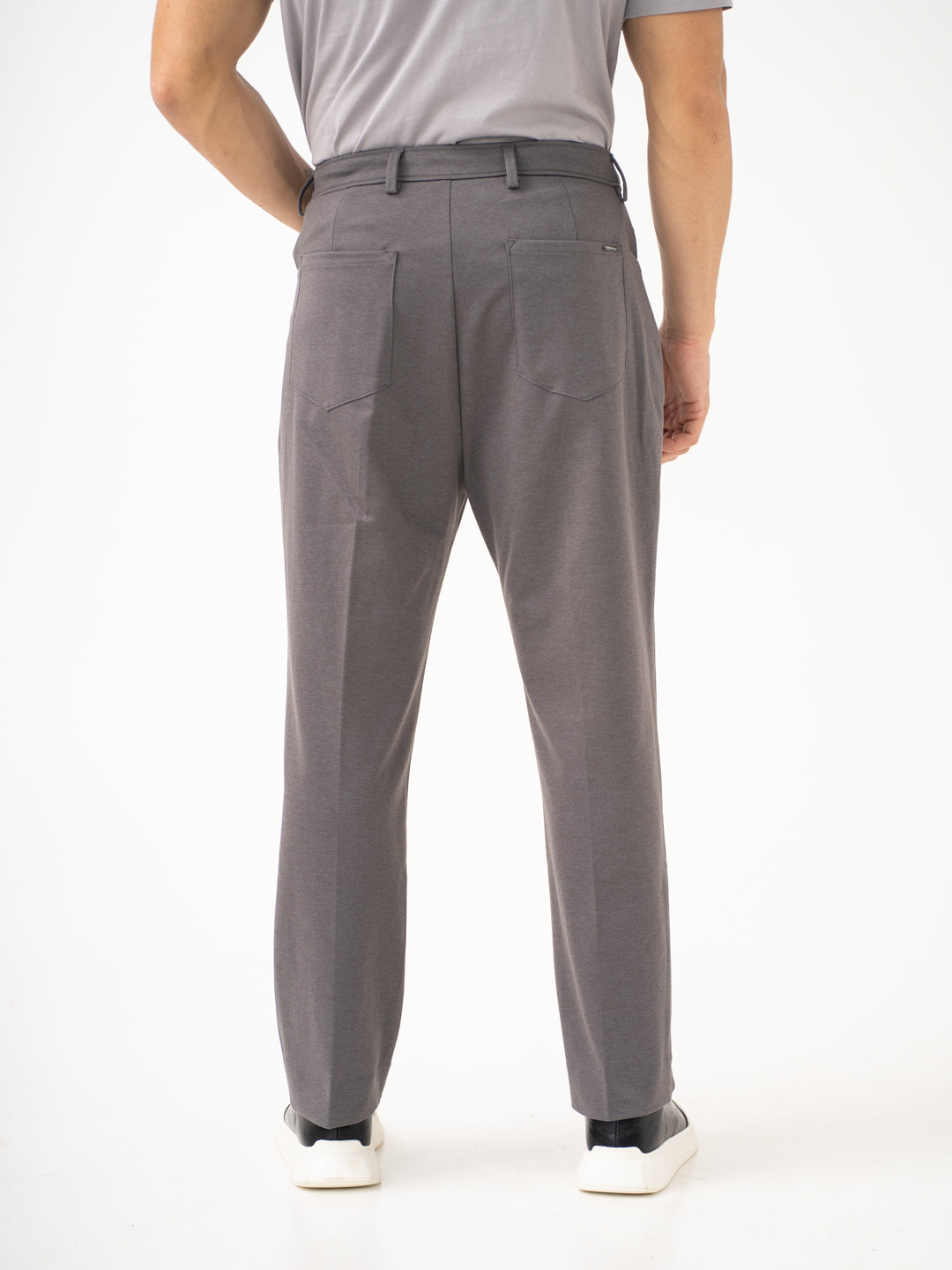 Rear view of grey pants by Pant Project focusing on the back pockets and relaxed fit