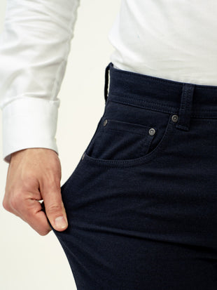 close up view of navy jeans by pant project with stretch fabric