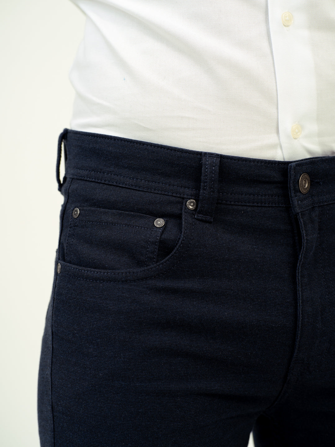 close up view of dark denim jeans by pant project with modern fit