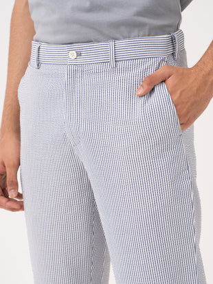 Captain navy blue trousers by Pant Project, showcasing the tailored fit and premium fabric in a modern setting.