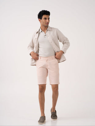 Poppy peach stretchable trousers by pant project, showcasing the pintuck detail and tailored fit.