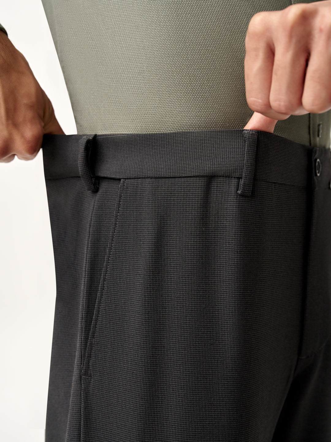 hands crossed, full front view on model wearing Pant Project slate grey trousers