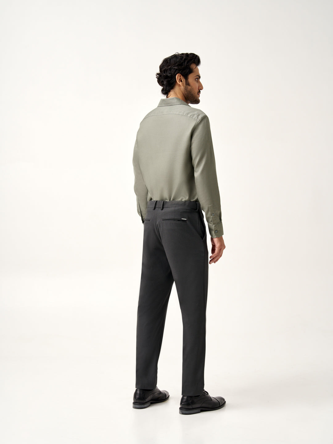 close view of button and waistband detail of the Pant Project slate grey stretch pants