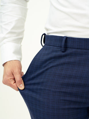 close-up front view of blue check pant by pant project showcasing stretch fabric