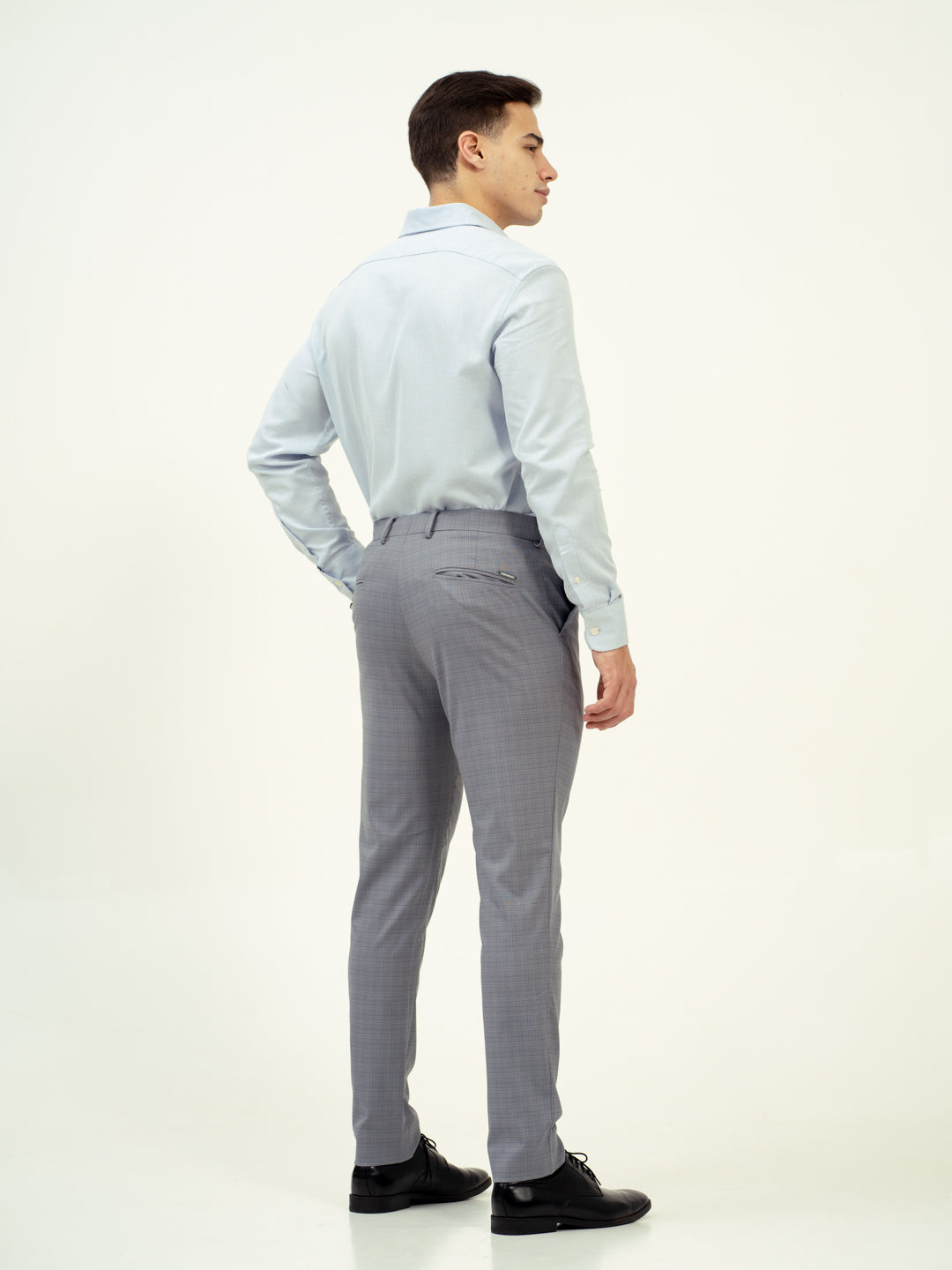 back view of grey check pant by pant project featuring tailored fit