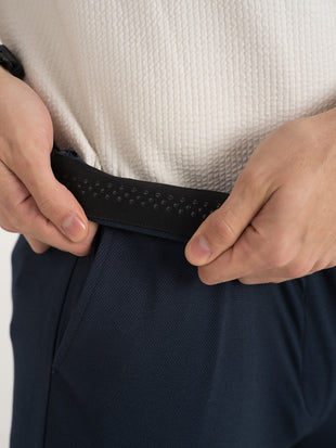 Close-up view of navy blue stretchable trousers by pant project, focusing on the elastic waistband