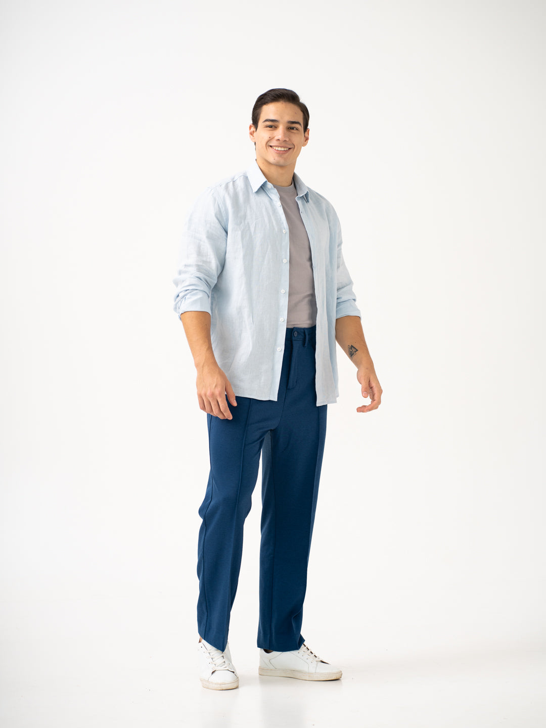 Full view of blue pintuck pants by pant project focusing on the relaxed fit and straight leg design