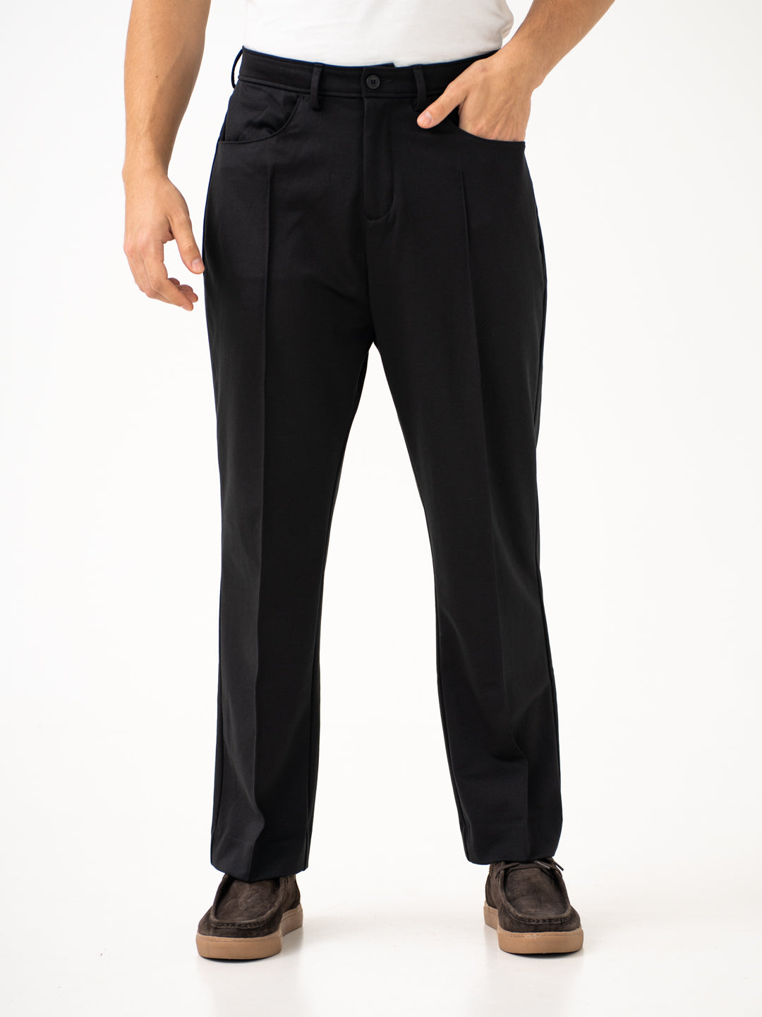 Front view of black pintuck pants by pant project, focusing on the pintuck design