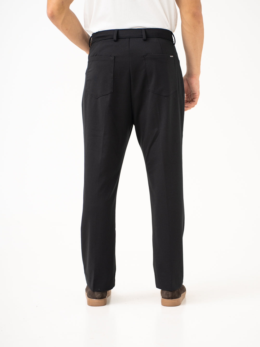 Back view of black pintuck pants by pant project focusing on the back pockets and waistband