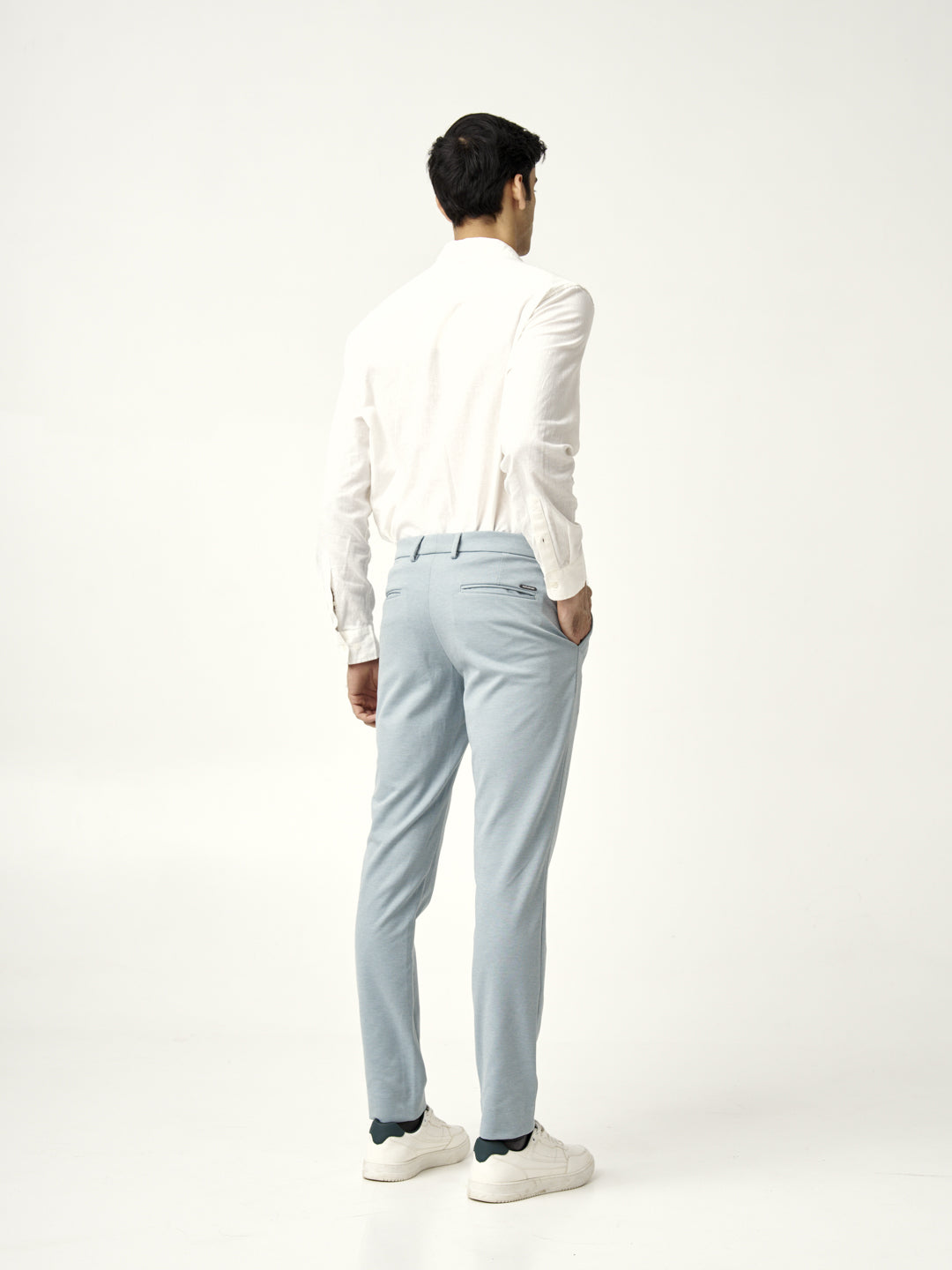 back view of light blue pants paired with a white shirt, from the Pant Project, go blue collection