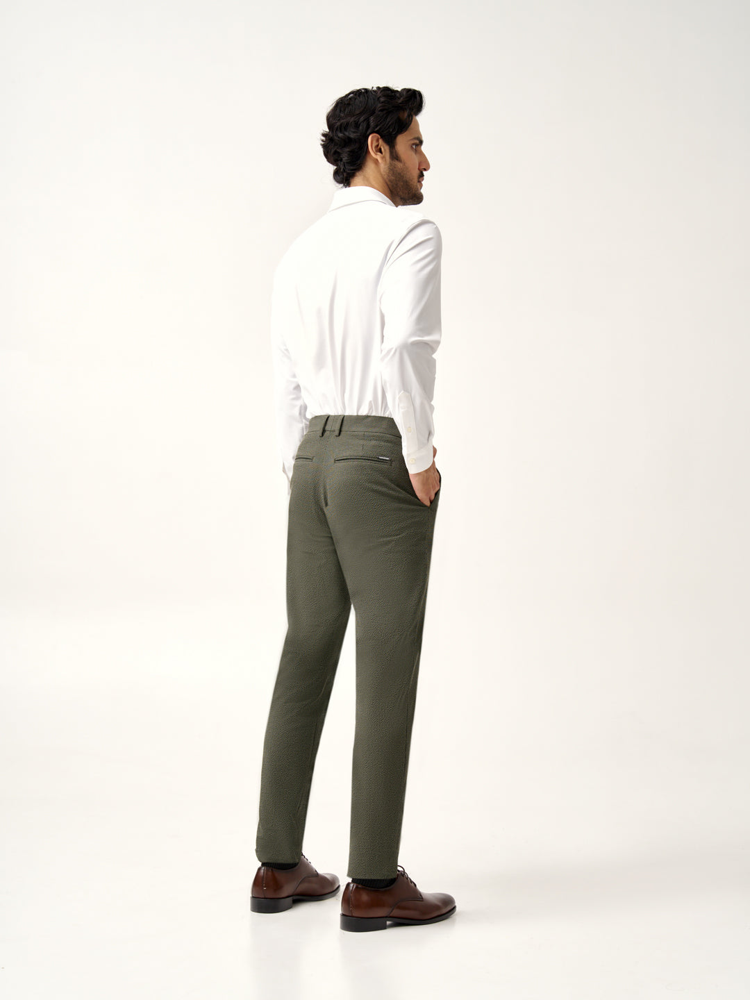 close-up of Pant Project's green stretchable chandigarh seer sucker trousers