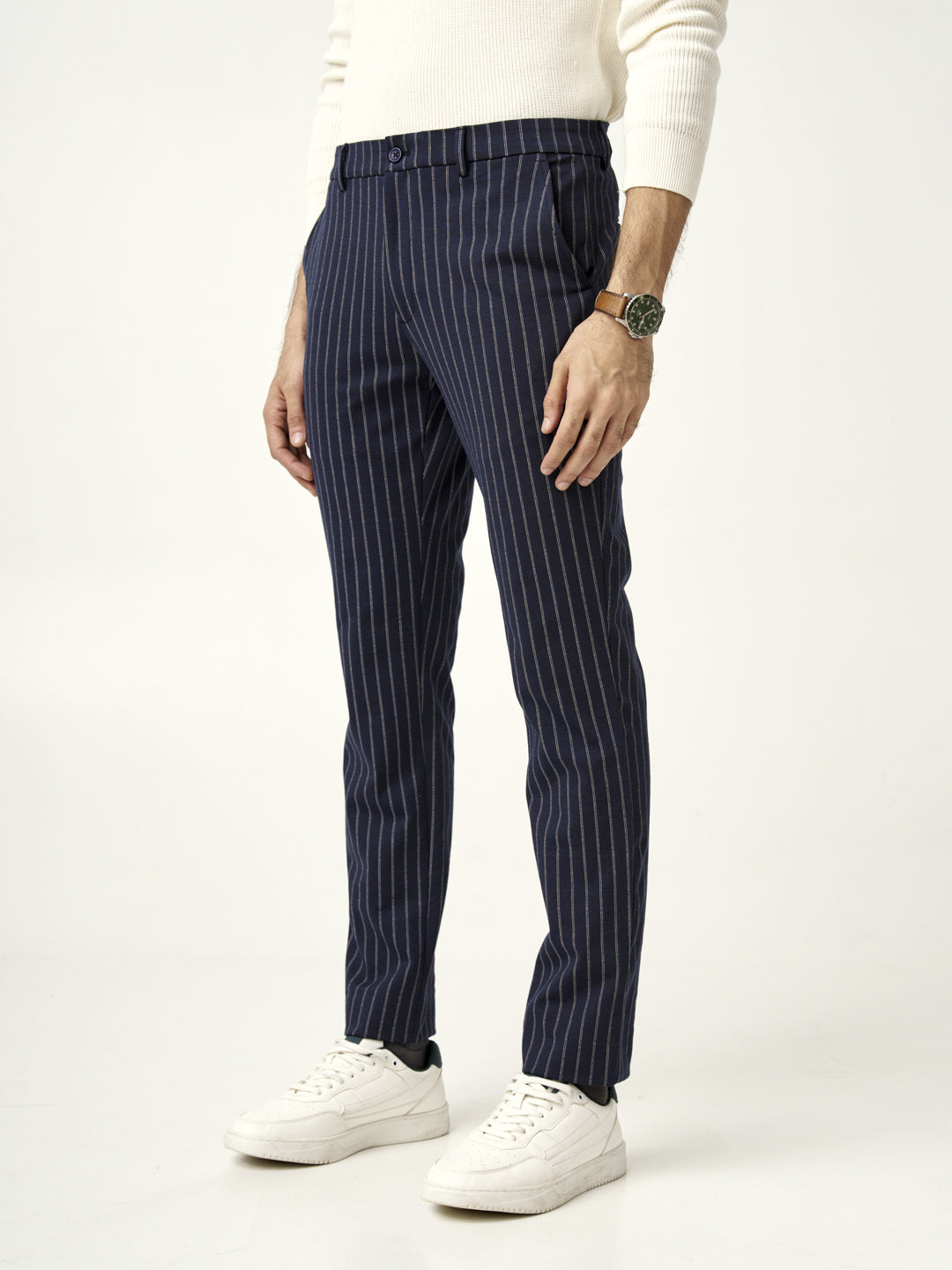 front view man wearing blue pinstripe pants with white sneakers by the Pant Project