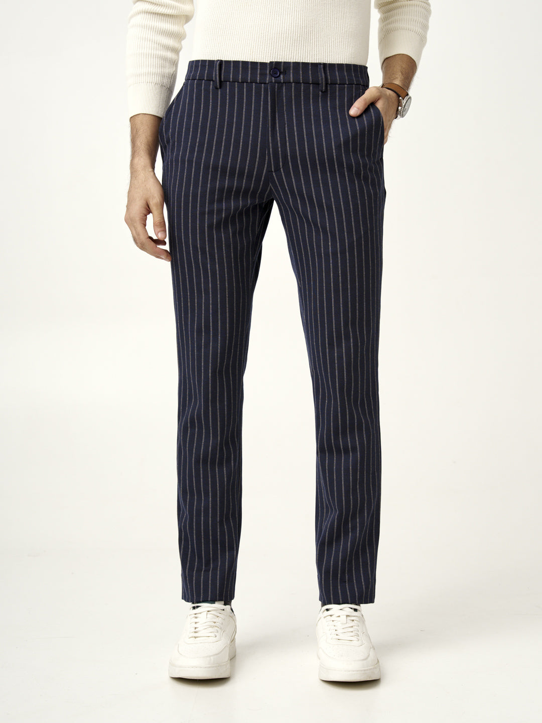 front view of blue pinstripe pants styled with a white sweater by the Pant Project