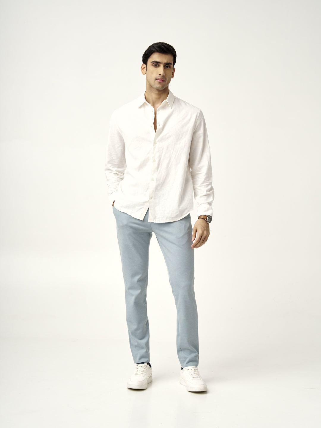 front view of the Pant Project's go blue custom-made pants styled with a white shirt