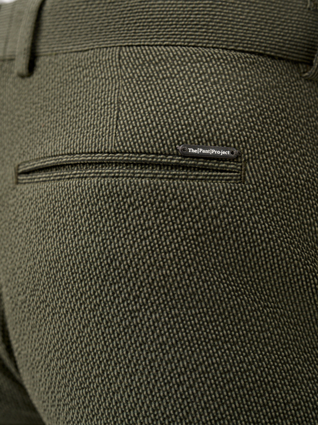 side view of Pant Project's green stretchable chandigarh seer sucker trousers