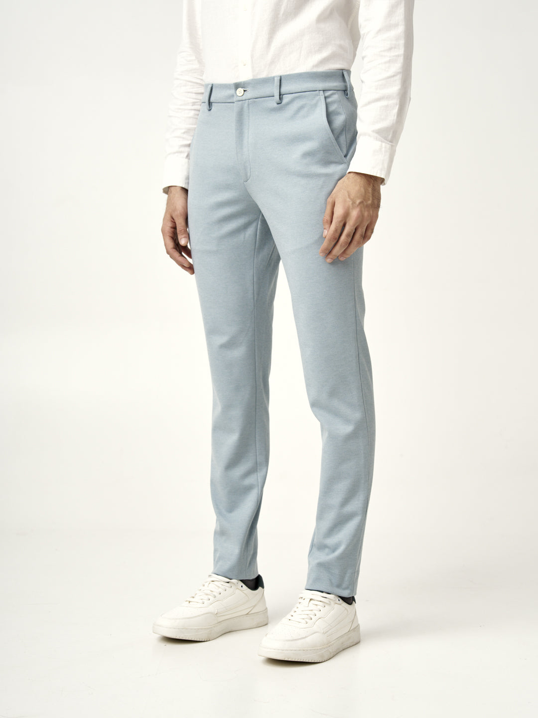 side view showing the stretchable fabric of the Pant Project's go blue pants