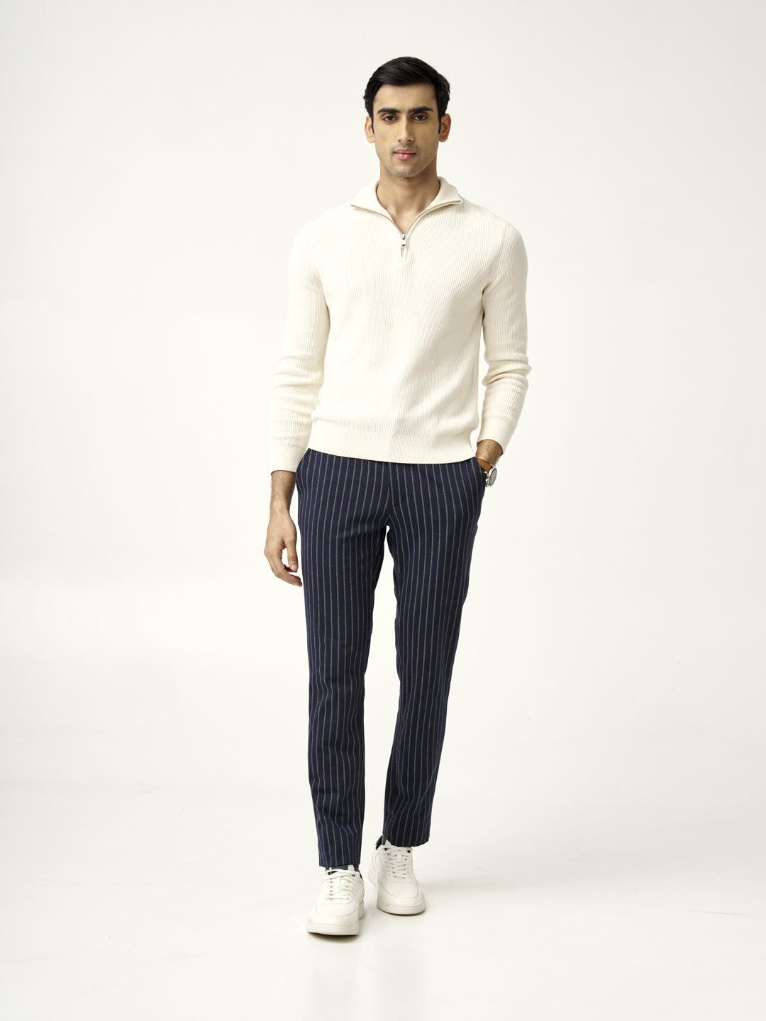 slim fit blue pinstripe pants styled with white sneakers from the Pant Project