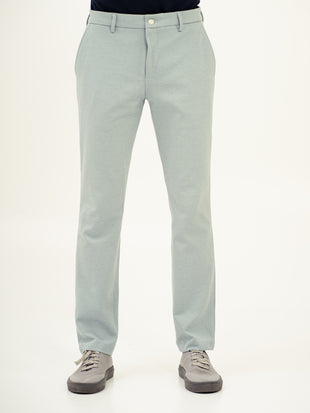 full view of blue stretchable trousers by pant project, focusing on the tailored fit and pintuck detailing