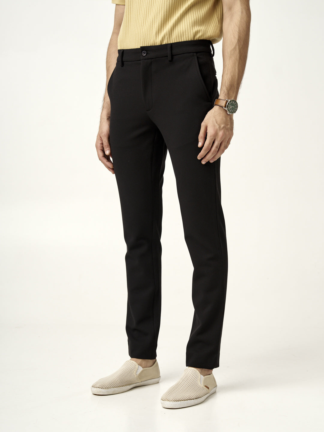 slim-fit pants paired with a mustard polo shirt, featuring the Pant Project modern black texture