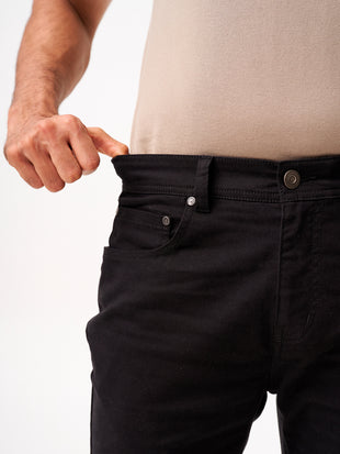 close-up front view of infinite black jeanos by pant project showcasing stretch fabric