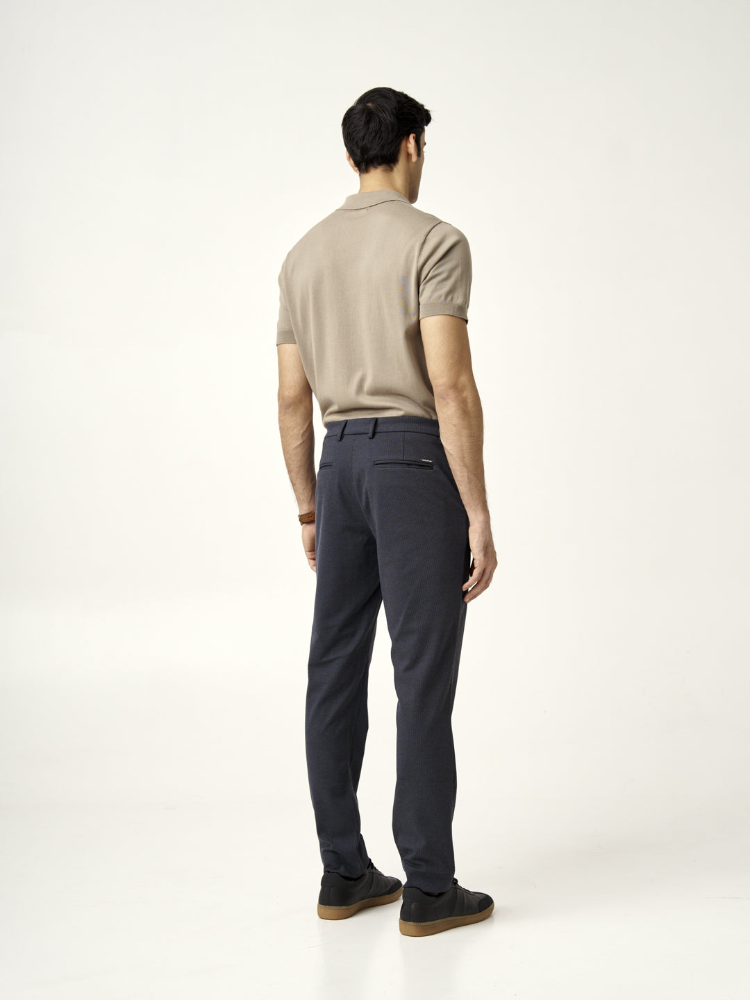 side view of man wearing storm grey pants by the Pant Project, paired with black shoes