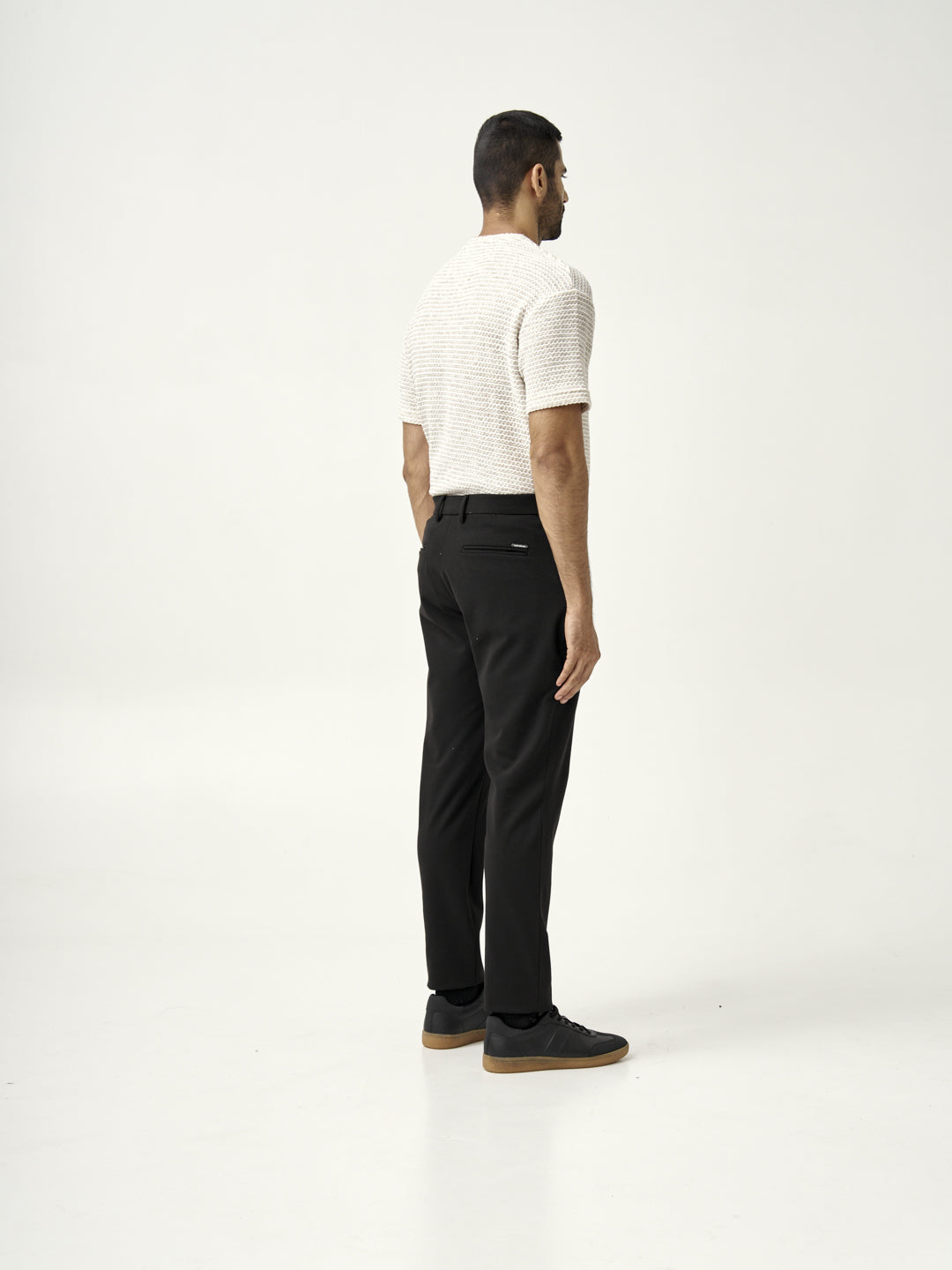 black pants highlighting the stretchability from the Pant Project double bloodstood