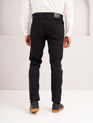 rear view of infinite black jeanos by pant project showing tailored fit