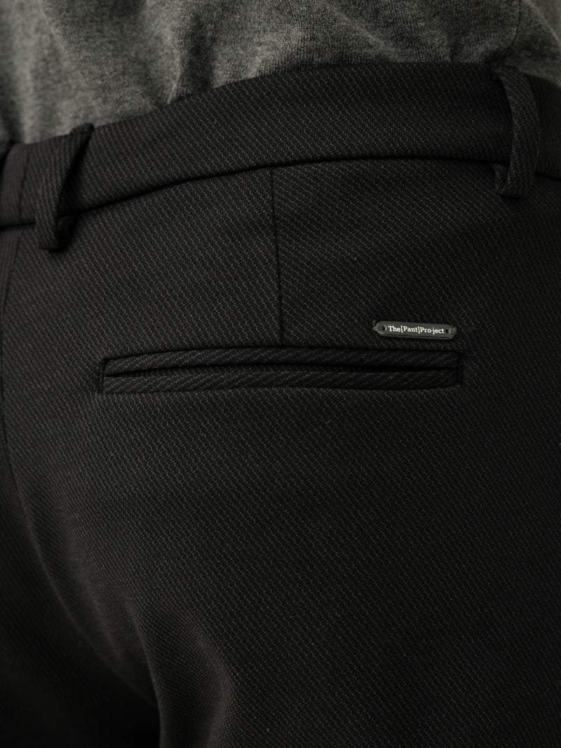 Back pocket detail of black twill structured slim power stretch pant at Pant Project