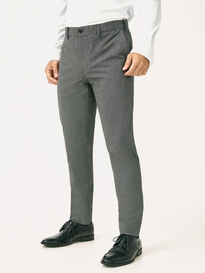 Side front view of black & white micro check slim fit stretch formal pant at Pant Project