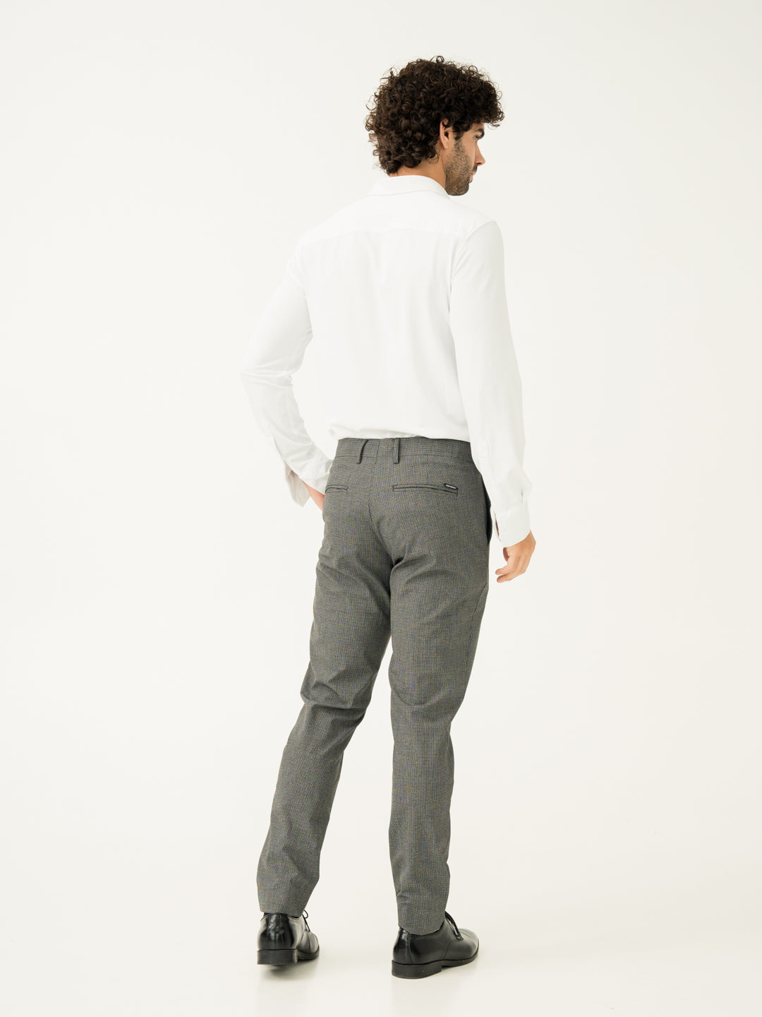 Back side view of black & white micro check slim fit stretch formal pant at Pant Project