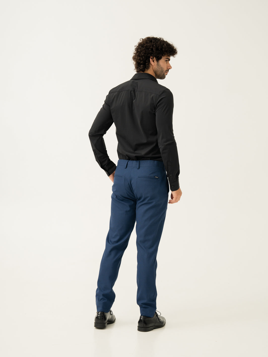 Back full side view of blue houndstooth slim fit stretch formal pant at Pant Project