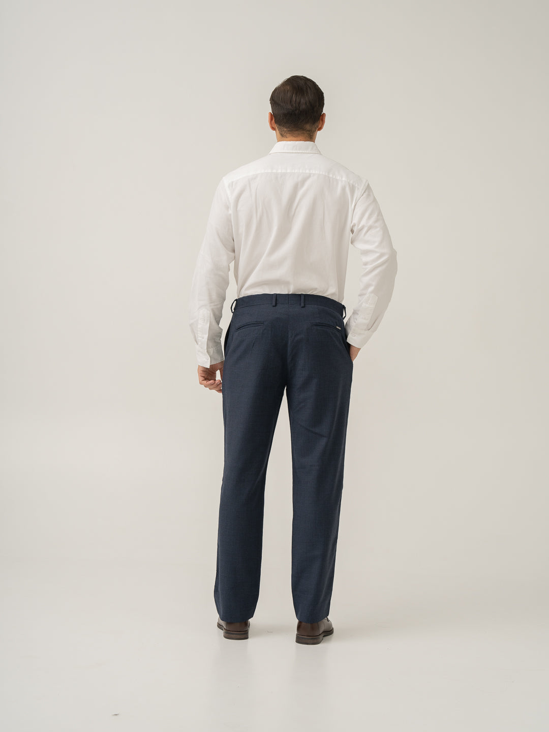 Full length back view of castle navy houndstooth merino wool pants at Pant Project