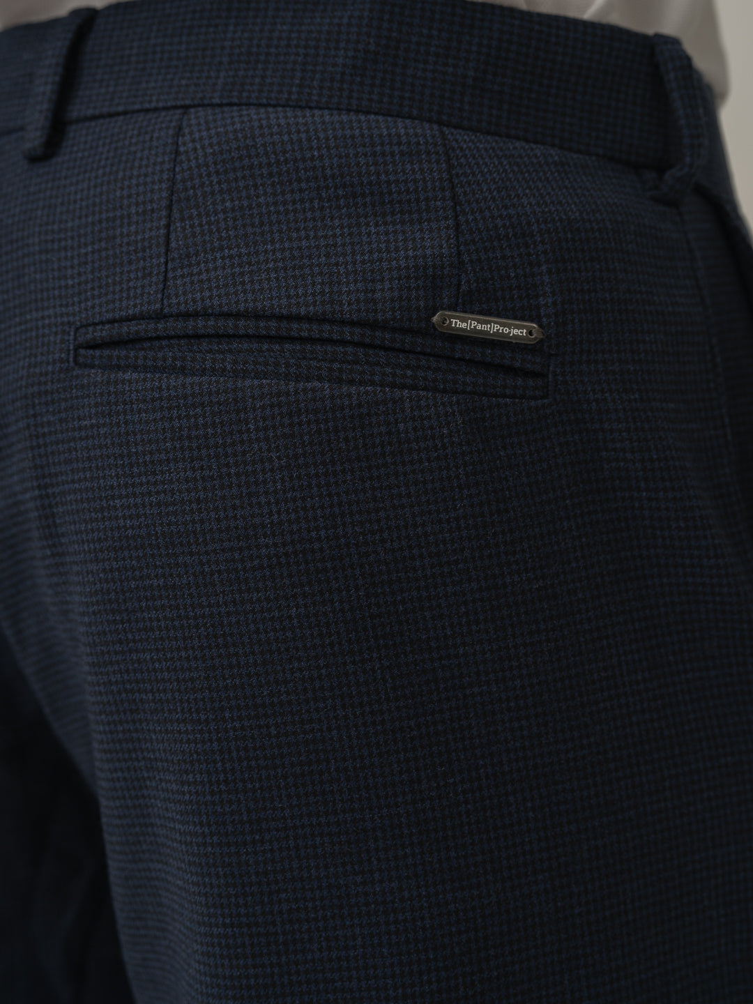 Back pocket detail of castle navy houndstooth merino wool pants at Pant Project