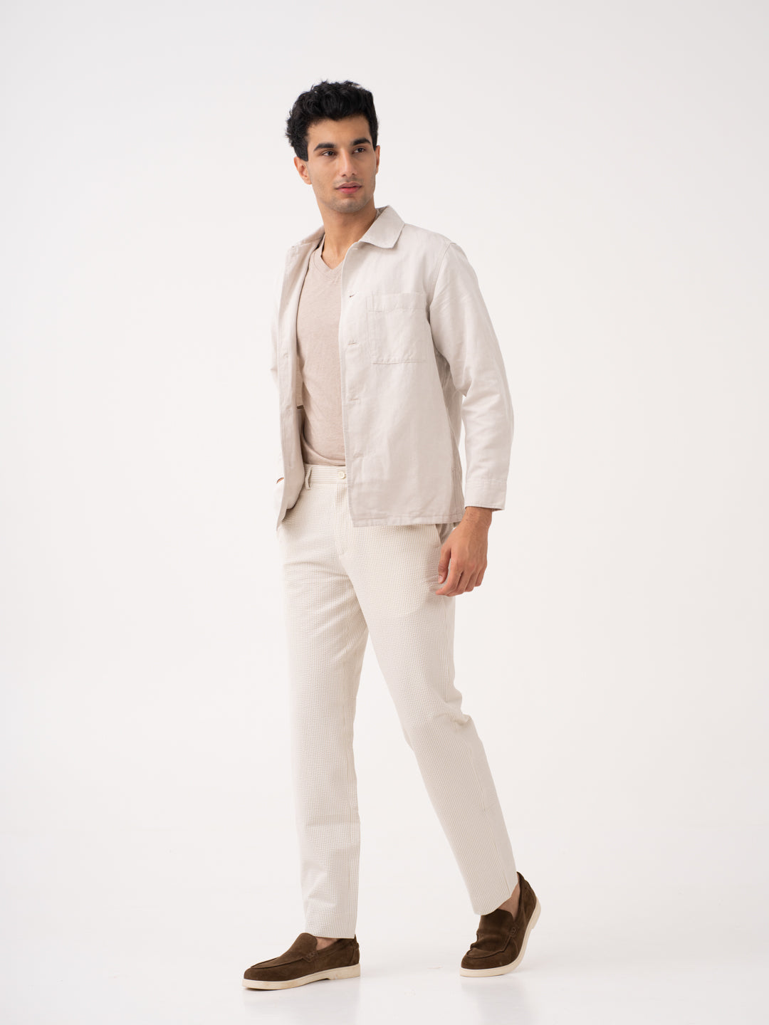Milo beige trousers by pant project, showcasing the tailored fit and smooth fabric texture.