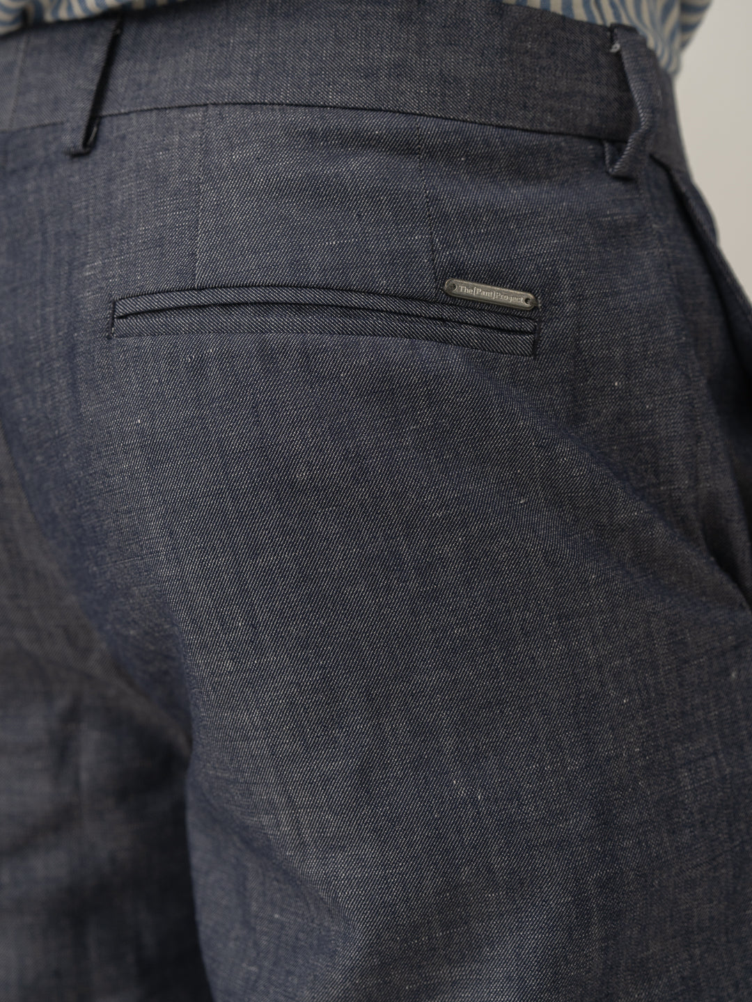 Back pocket detail of whistle blue tropical wool linen pant at Pant Project