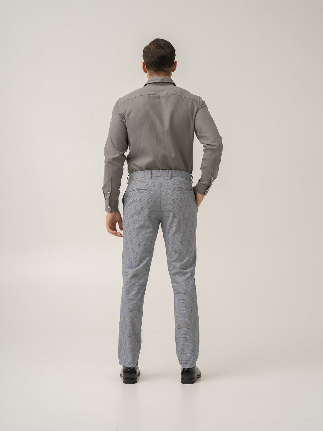 Full length back view of blue black houndstooth checks formal pant at Pant Project