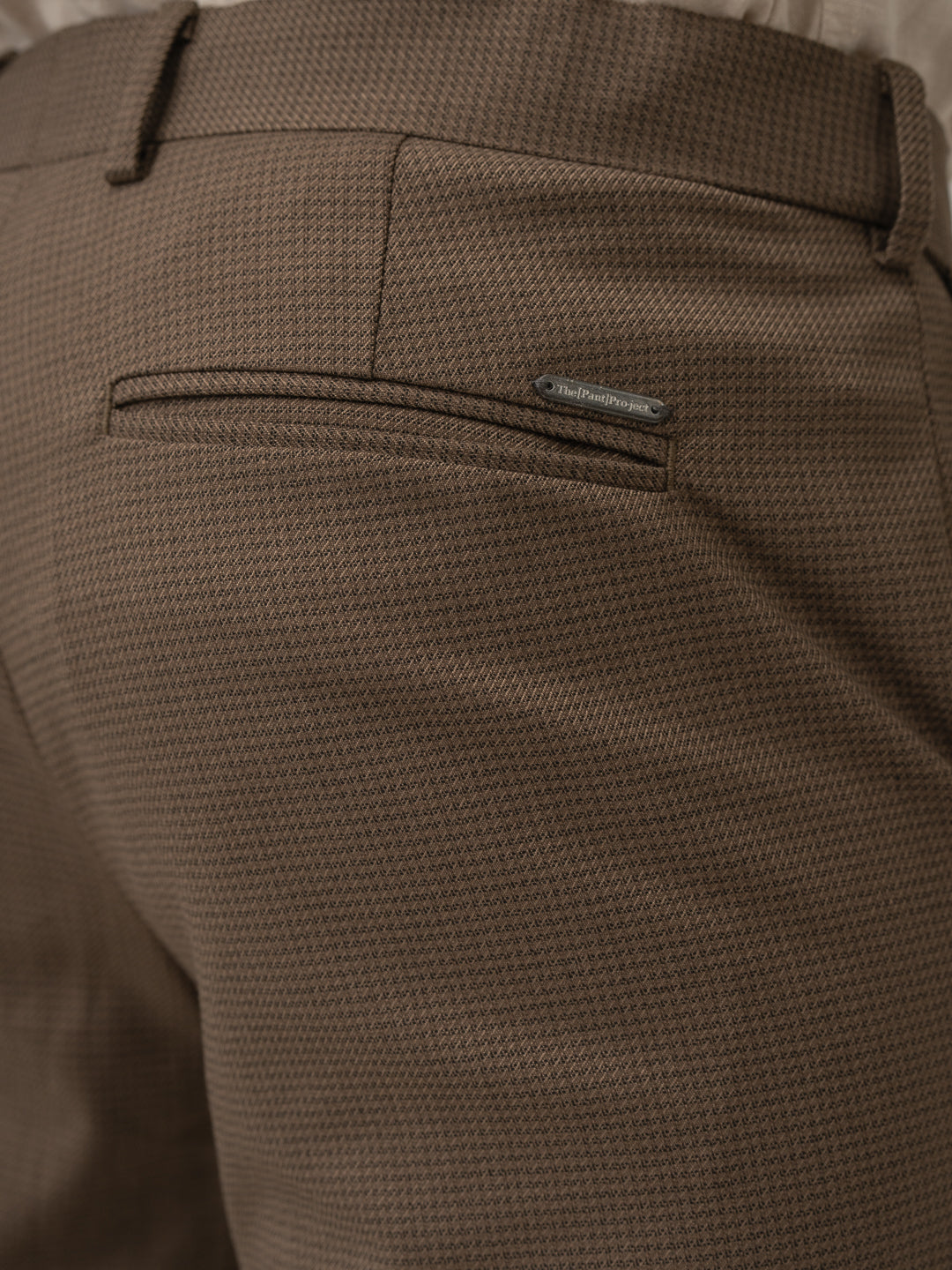 Back pocket detail of acon brown textured formal pant at Pant Project