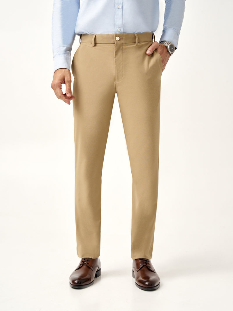 full view of Pant Project's camel stretchable trousers with a light blue shirt