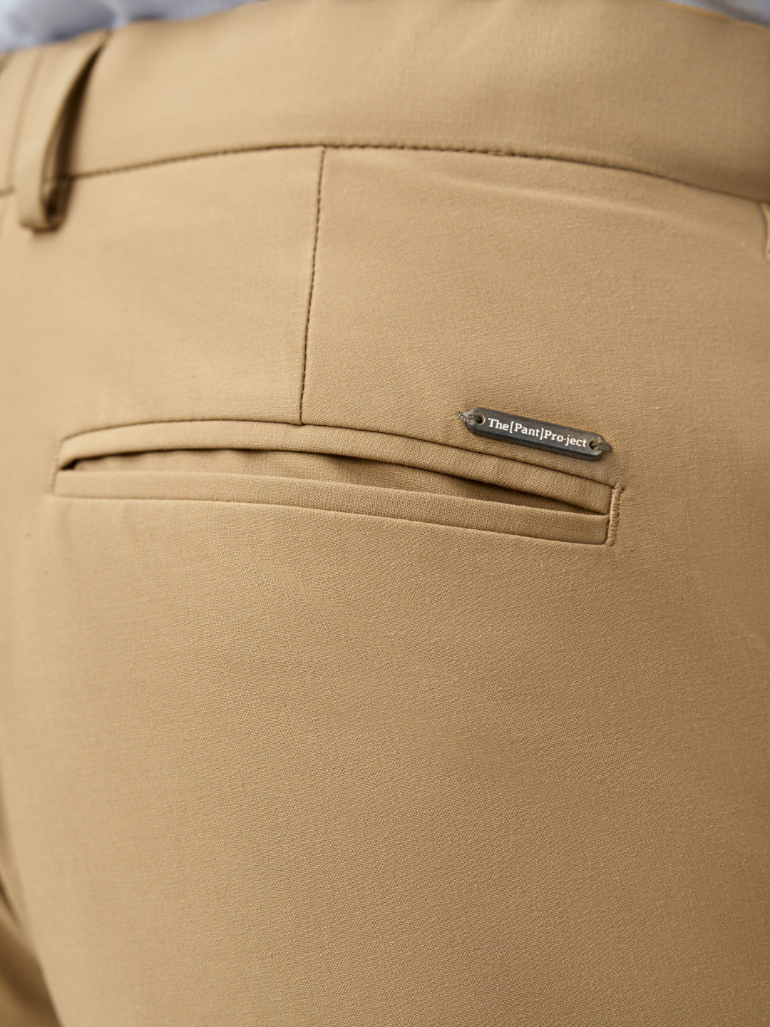 close-up of Pant Project's camel stretchable trousers waistband