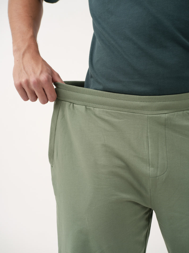 close-up view of green sweatpant by pant project showing elastic waistband