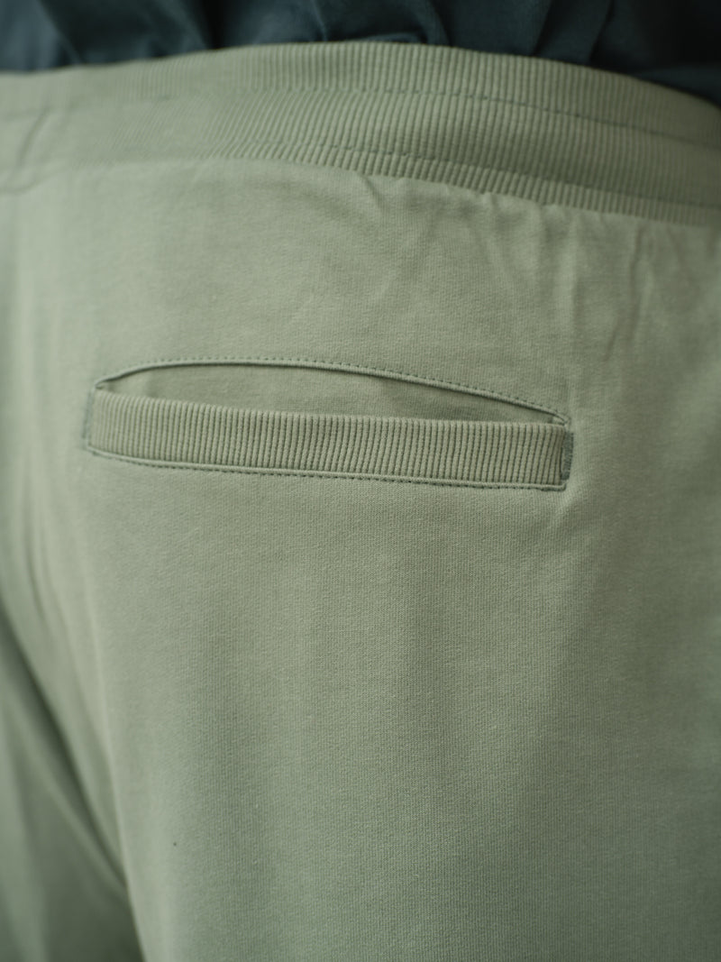 close-up back view of olive sweatpant by pant project showing pocket detail