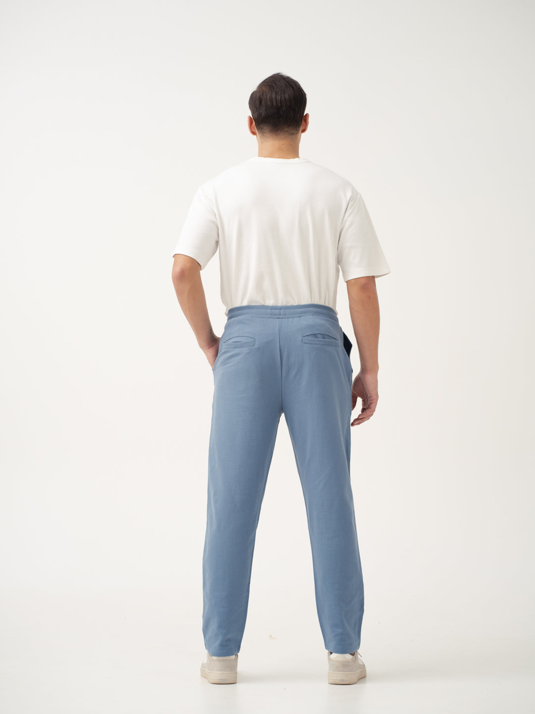 back view of pixel blue sweatpant by pant project showcasing tailored fit